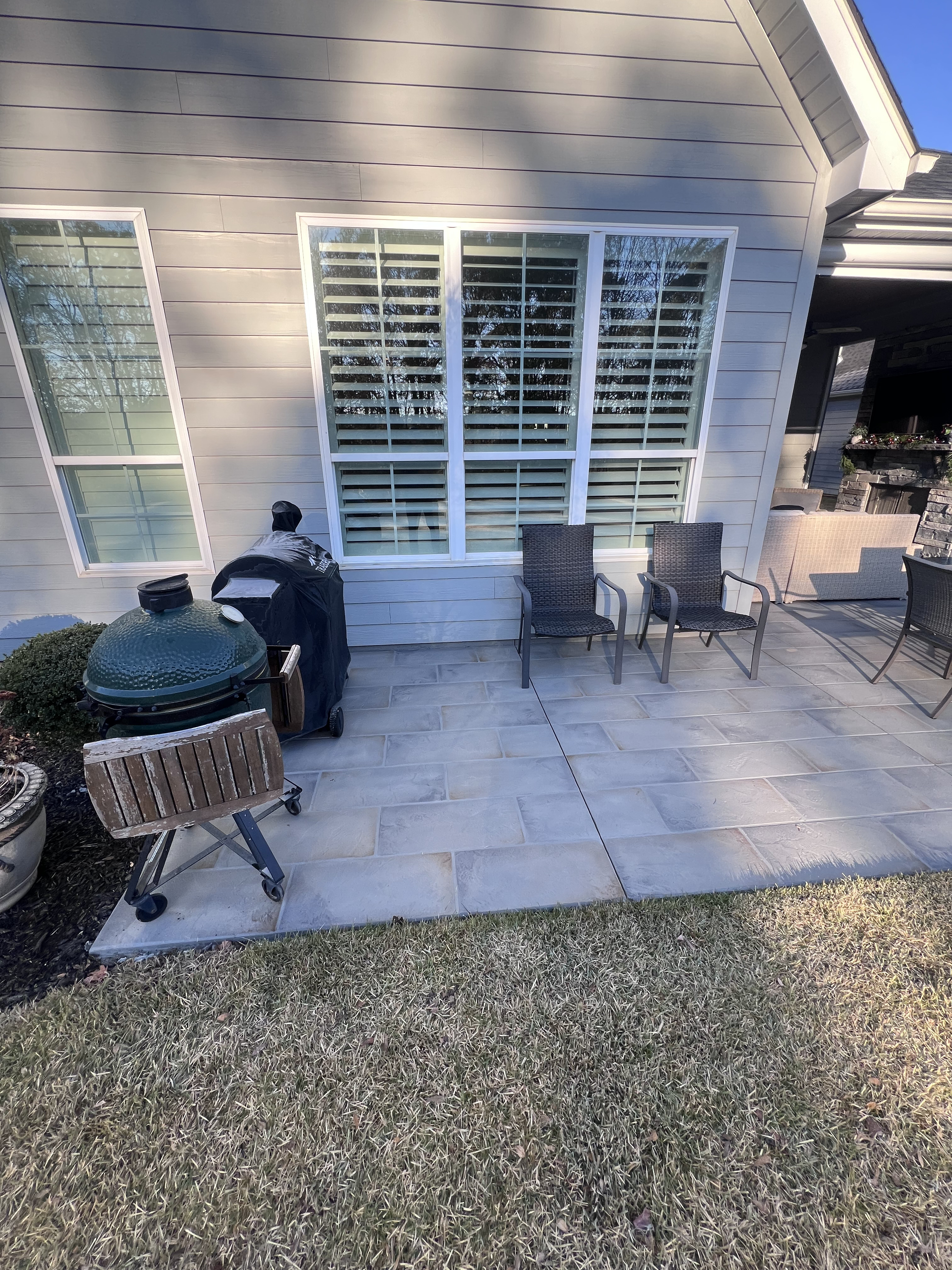 Backarea with decorative concrete patio and handcrafted finish